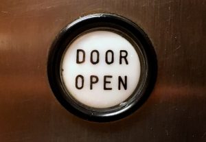 Door Open button as on a panel in an elevator