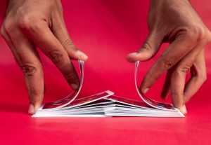 Close up of hands shuffling a deck of cards