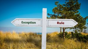 A sign pointing in two opposite directions: "Exception" and "Rule."