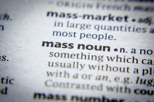 Extreme closeup of part of a dictionary entry for the phrase "mass noun"