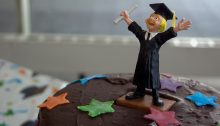 Cheering student on graduation cake