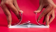 Close up of hands shuffling a deck of cards