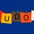 The five letters of the word “KUDOS” tacked onto a blue background on five sticky notes of various colors.