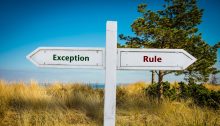 A sign pointing in two directions: "Exception" and "Rule."