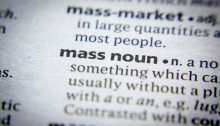 Extreme closeup of part of a dictionary entry for the phrase "mass noun"